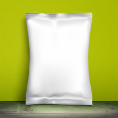 Blank white packaging. Sample package. Blank template for design. Net packaging is on shelf. Mockup Foil Food Snack pack, packaging, wrapper. Plastic Pack Template for design and branding. Green wall