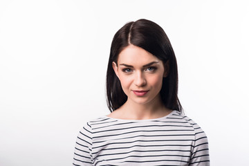Fototapeta premium Pleasant beautiful girl standing on white background 