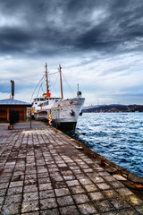 Passengers'  boat, moored by the pier, Istanbul, Bosphorus channel.