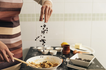 Beautiful woman Preparing Cookies And Muffins.