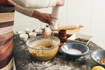 Beautiful woman Preparing Cookies And Muffins.