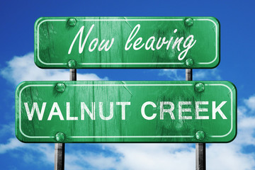 Leaving walnut creek, green vintage road sign with rough letteri