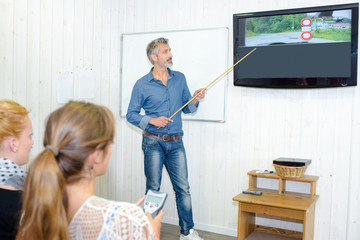 Driving instructor teaching highway code