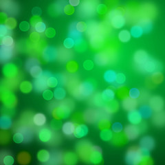 Obraz premium warm bokeh effects in shades of green and blue in front of a dark background