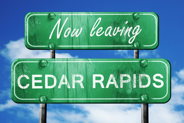 Leaving cedar rapids, green vintage road sign with rough letteri