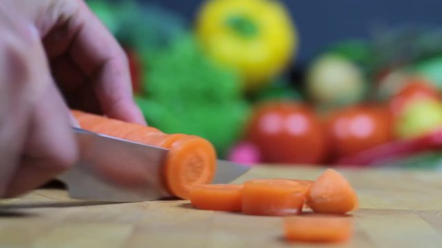 Chopping carrot on chopping board (1080p HD Video )