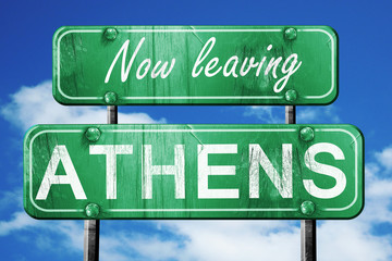 Leaving athens, green vintage road sign with rough lettering