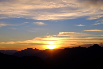 Sunrise with Clouds over Mountains. 
California, United States. 