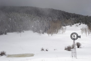 Winter Storm Approaching a Windmill