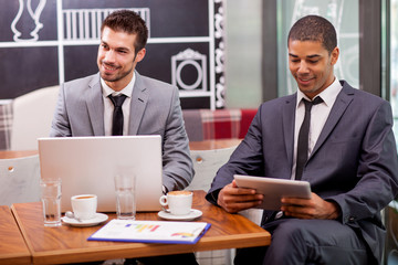 two young businessman in the coffee break