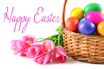 Fototapeta na wymiar Easter greeting card. Multicoloured eggs in basket isolated on white