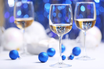 Wineglasses on blue blurred background