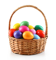 Fototapeta na wymiar Multicoloured Easter eggs in basket isolated on white