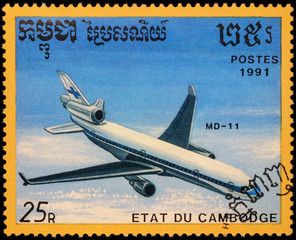 Aircraft McDonnell Douglas MD-11 on postage stamp