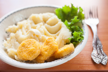 mashed potatoes in a plate on a table, selective focus