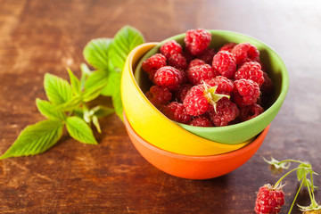 raspberry in a bowl on a table, selective focus