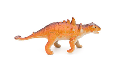 side view orange Pinacosaurus toy on a white background