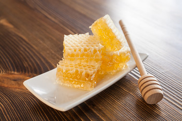 honey in honeycombs on a table, selective focus