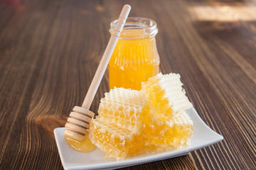 honey in honeycombs on a table, selective focus