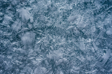 The ice cracked on a lake.