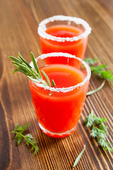 tomato juice in glasses on a table, selective focus