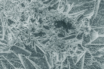 The ice cracked on a lake.