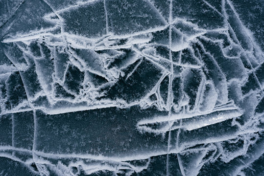 The ice cracked on a lake.