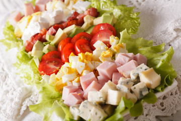 American Cobb salad close-up on a plate. horizontal
