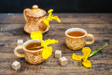 spring tea in cups on a table, selective focus