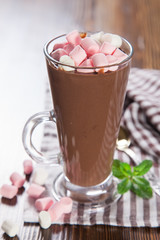 hot chocolate with a souffle in a glass on a table, selective focus