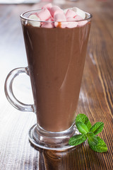 hot chocolate with a souffle in a glass on a table, selective focus