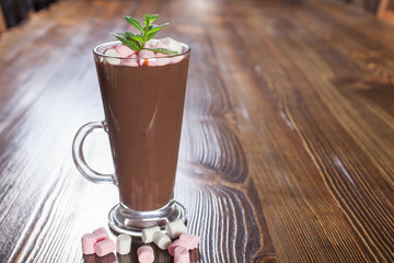 hot chocolate with a souffle in a glass on a table, selective focus