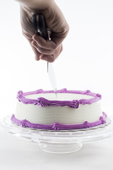 Cake with plain frosting and space for text on a bright backgrou