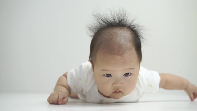 Asian chinese baby smiling happy on a white background