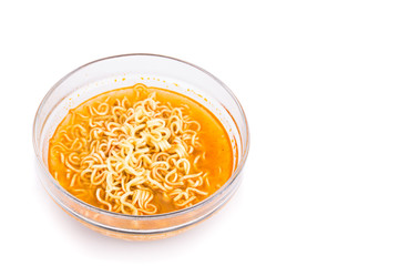 Bowl of convenient but unhealthy instant noodle with sodium flavored soup on white background 