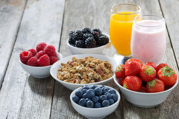 healthy breakfast with fresh berries on wooden background