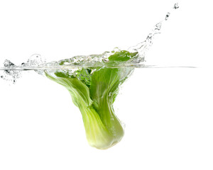 fresh vegetable falling into clear water with big splash