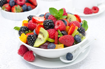 salad of fresh fruit and berries in a white bowl, berries 