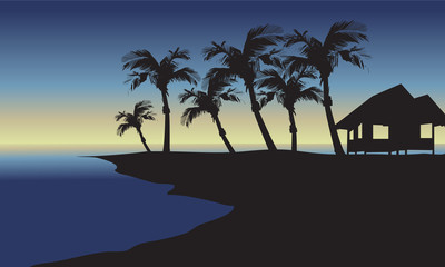 Fototapeta na wymiar Silhouette of hut and palm