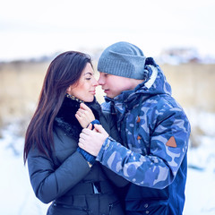 Beautiful adult couple love, park in winter