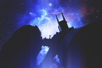 Stargazing through a telescope. 