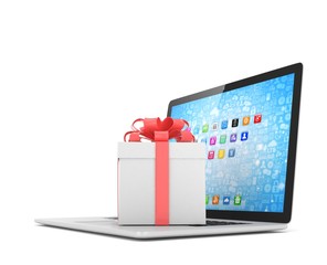 Gift box with ribbon on laptop keyboard. 3d rendering.