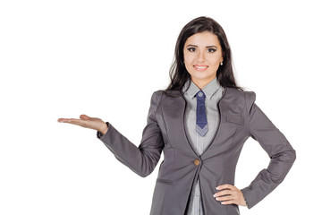 Young woman holding something imaginary on palm of her hand isolated on white background