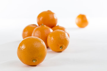 Bright Orange Clementines on a bright background