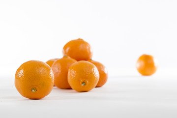 Bright Orange Clementines on a bright background