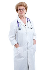 Mature female doctor looking at the camera, hands in pockets, isolated on white background