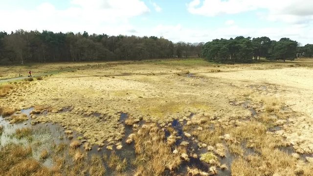 Aerial shot panning over Yorkshire moorland with marshland