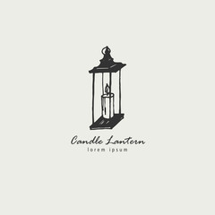 Rustic candle lantern logo in the style of a sketch. The symbol of warmth and comfort.
