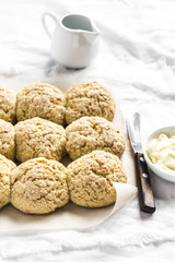 Orange oatmeal scones on a light background