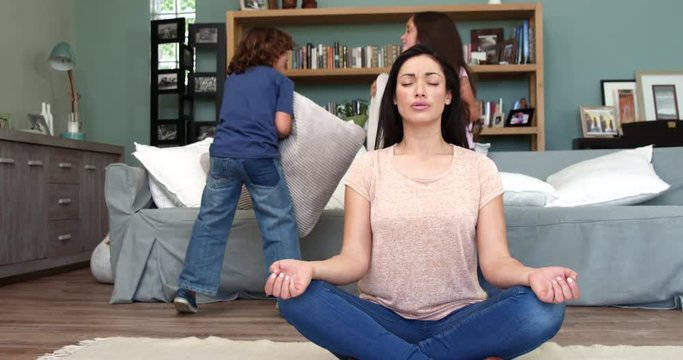 Mother trying to relax while children playing
